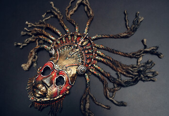 Creative african mask, dark studio background