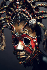 Creative african mask, dark studio background