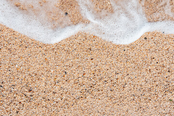 Fototapeta na wymiar Sea sand with water splash
