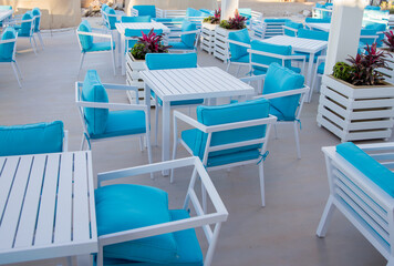chairs and tables in a beach restaurant