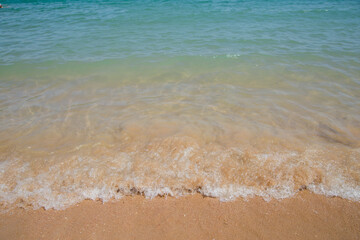 clear azure water on the beach with sand