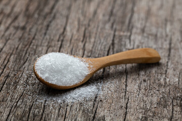 monosodium glutamate, MSG on wooden spoon