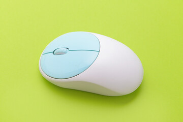 Modern computer mouse on color background