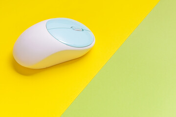 Modern computer mouse on color background