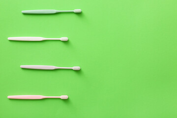 Tooth brushes on color background