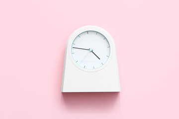 Fototapeta na wymiar Simple clock on color background