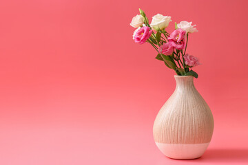 Beautiful vase with flowers on color background