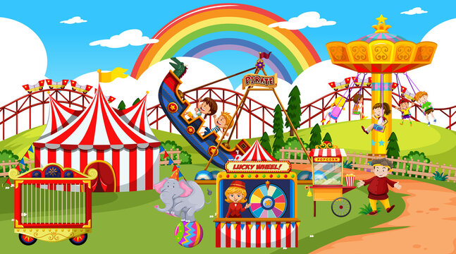 Amusement park scene at daytime with rainbow in the sky