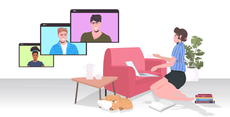 woman chatting with mix race colleagues in web browser windows during video call online conference meeting remote work self isolation concept horizontal vector illustration
