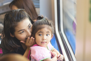 Fototapeta premium mother explain to daughter in adventure trip with train