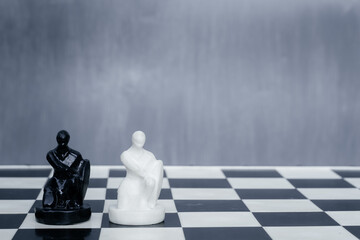 Black and white chess pieces on the chessboard. The concept of combating racism. Motivational...
