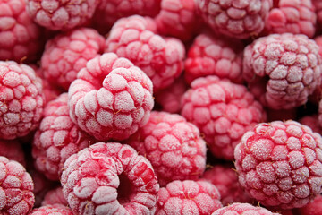Tasty frozen raspberries as background