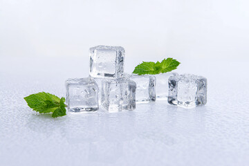 Ice cubes and mint on white background