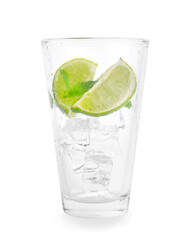 Glass with ice cubes, lime and mint on white background