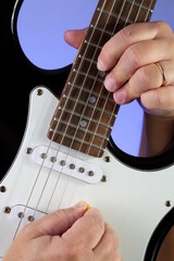 Closeup of man hands playing the guitar.