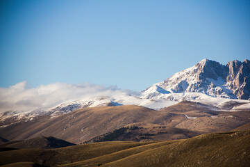 Beautiful snow capped mountains in the Italian countryside