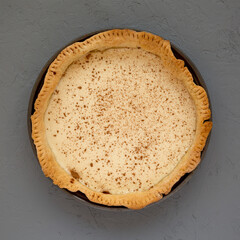 Homemade Sugar Cream Pie on a gray background, top view. Flat lay, overhead, from above.