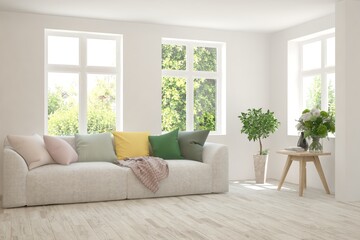 White living room with sofa and summer landscape in window. Scandinavian interior design. 3D illustration