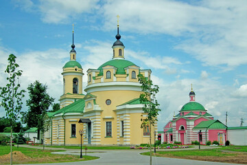 Fototapeta na wymiar Anocin Borisoglebsky monastery (1823), Trinity Cathedral, bell tower and Church of St.Dimitry of Rostov (1824). Moscow region (2013).
