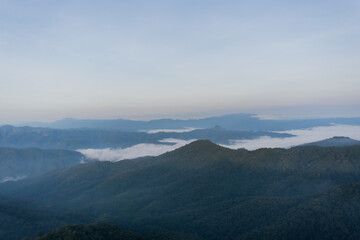 Fototapeta premium beautiful view on top mountain and mist at morning light. soft focus.