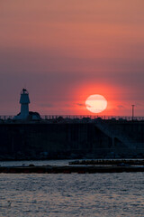Fototapeta na wymiar View of sunrise from the port