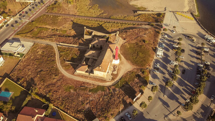 Aerial view of the Farol de Esposende (Esposende Lighthouse) set in front of the Fort of Sao Joao Baptista de Esposende is situated at the mouth of Cavado river, north of Portugal.