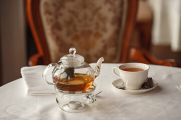 Tea Party with sweet cakes over table background in a charming classic restaurant