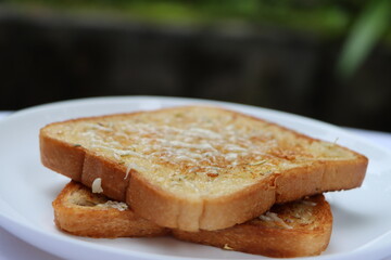 Garlic cheese bread toast, with herbs, morning breakfast  