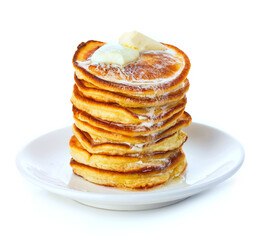 Stack of small pancakes in syrup on white background.