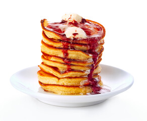 Stack of small pancakes in syrup on white background.