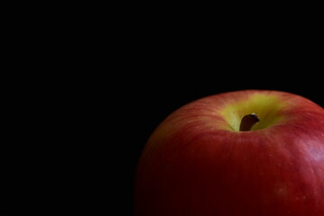 Red Apple on black background.