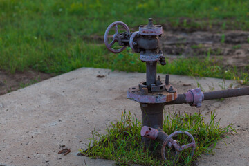 Fototapeta premium Oil pipes and valves in an oil field