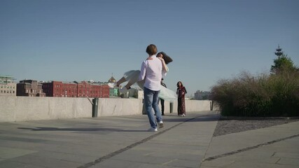 Dancers are dancing a Spanish dance on the river embankment. Street musicians and dancers.
