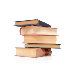 Stack of books in colour covers with white sheets isolated on a white background
