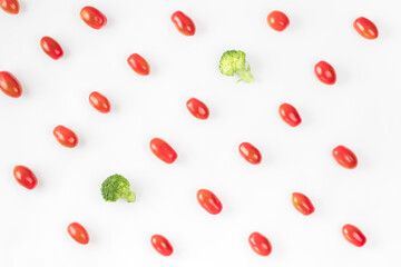 Fresh vegetables pattern on white background. Ingredients for vegetable salad. Creative food concept. Flat lay, top view. Cherry tomato and broccoli layout. Minimal art.
