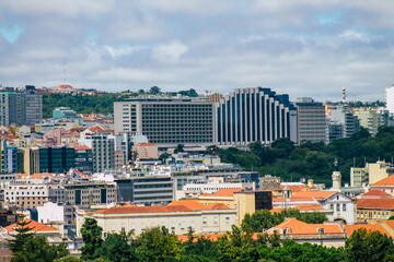 Fototapeta na wymiar Panoramic view of historical buildings in the downtown area of Lisbon, the hilly coastal capital city of Portugal and one of the oldest cities in Europe 
