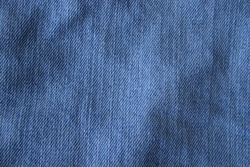 Dark blue textile background or indigo fabric cloth background.
