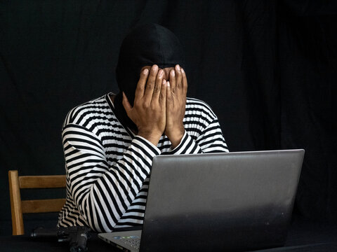 Hacker Wear Ski Mask With Both Hands On Face