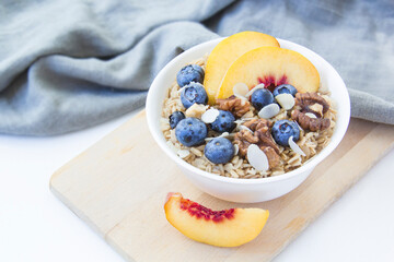 Oatmeal porridge with blueberries. Superfood for healthy nutritious breakfast