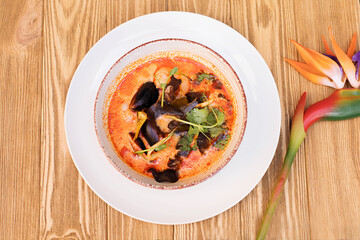 Soup with mussels, exotic Soup of Asian cuisine, view from above