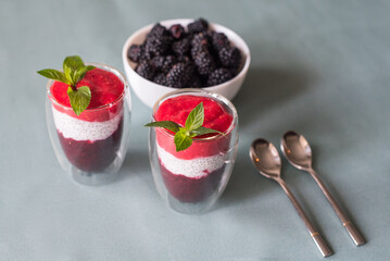 Tasty yogurts on a green table. Soft selectiv focus. Healthy desserts. Healthy concept of life