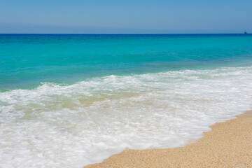 
blue sea, white wave and clean sand on the cleopatra beach in alanya
