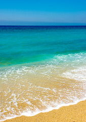 
blue sea, white wave and clean sand on the cleopatra beach in alanya
