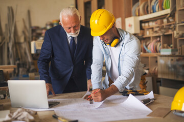 Engineer introducing business owner with project plan