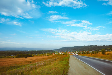 Fototapeta premium grass field and cloudy sky