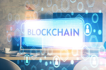 Multi exposure of blockchain theme hologram and table with computer background. Concept of bitcoin...