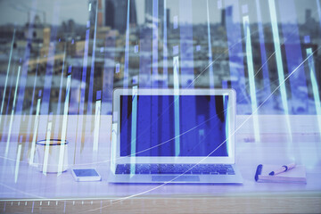 Financial graph colorful drawing and table with computer on background. Double exposure. Concept of international markets.