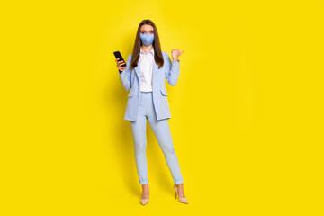 Full length photo smm girl use smartphone follow covid post news point thumb finger copyspace...