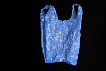  blue plastic bag on black background