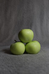 green apple on a wooden table
